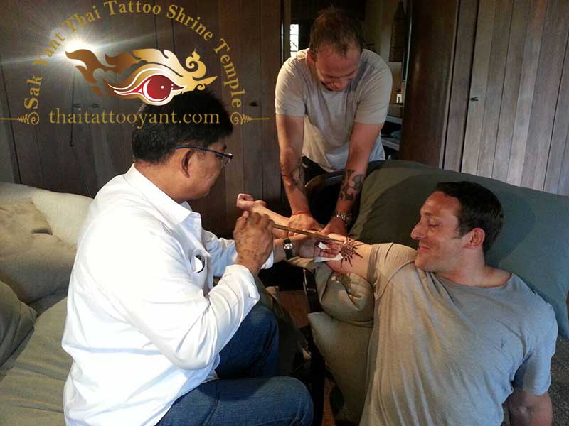 Friends and team members getting Sak Yants Thai Tattoo Designs