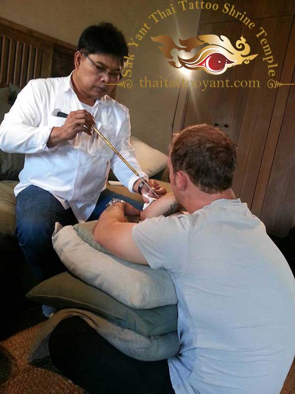 Friends and team members getting Sak Yants Thai Tattoo Designs